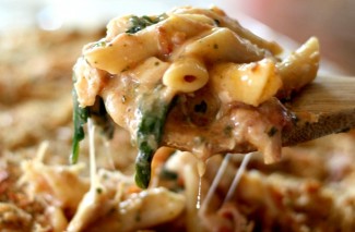 Baked Chicken Pesto Alfredo Freezer Meal- made with chicken, basil pesto, bacon, cheese, spinach and tomatoes mixed together in a delicious white sauce. So good!!