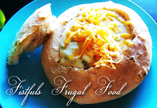 Soup in a bread bowl with text \"Fistfuls Frugal Food.\"