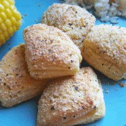 Biscuit bites on a plate with corn.