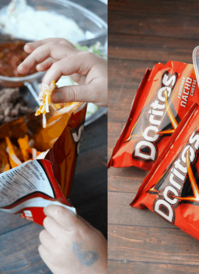 Person adding cheese to a bag of Doritos next to bags of Doritos, one of which has a spoon.