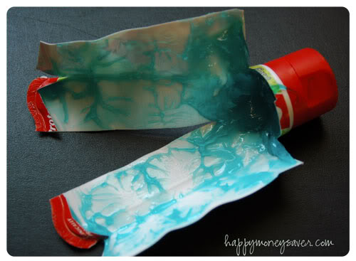 Bottle of toothpaste that has been cut open.