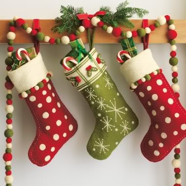 Green and red stocking with Christmas decorations.