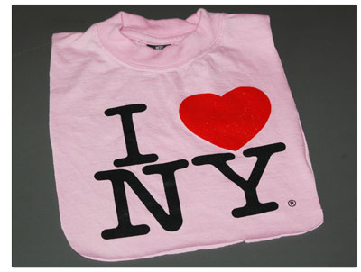 Pink T-shirt bib that says "I (heart) NY."