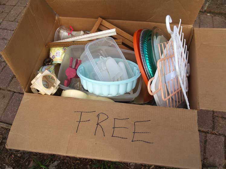 Box of assorted items labeled "FREE."