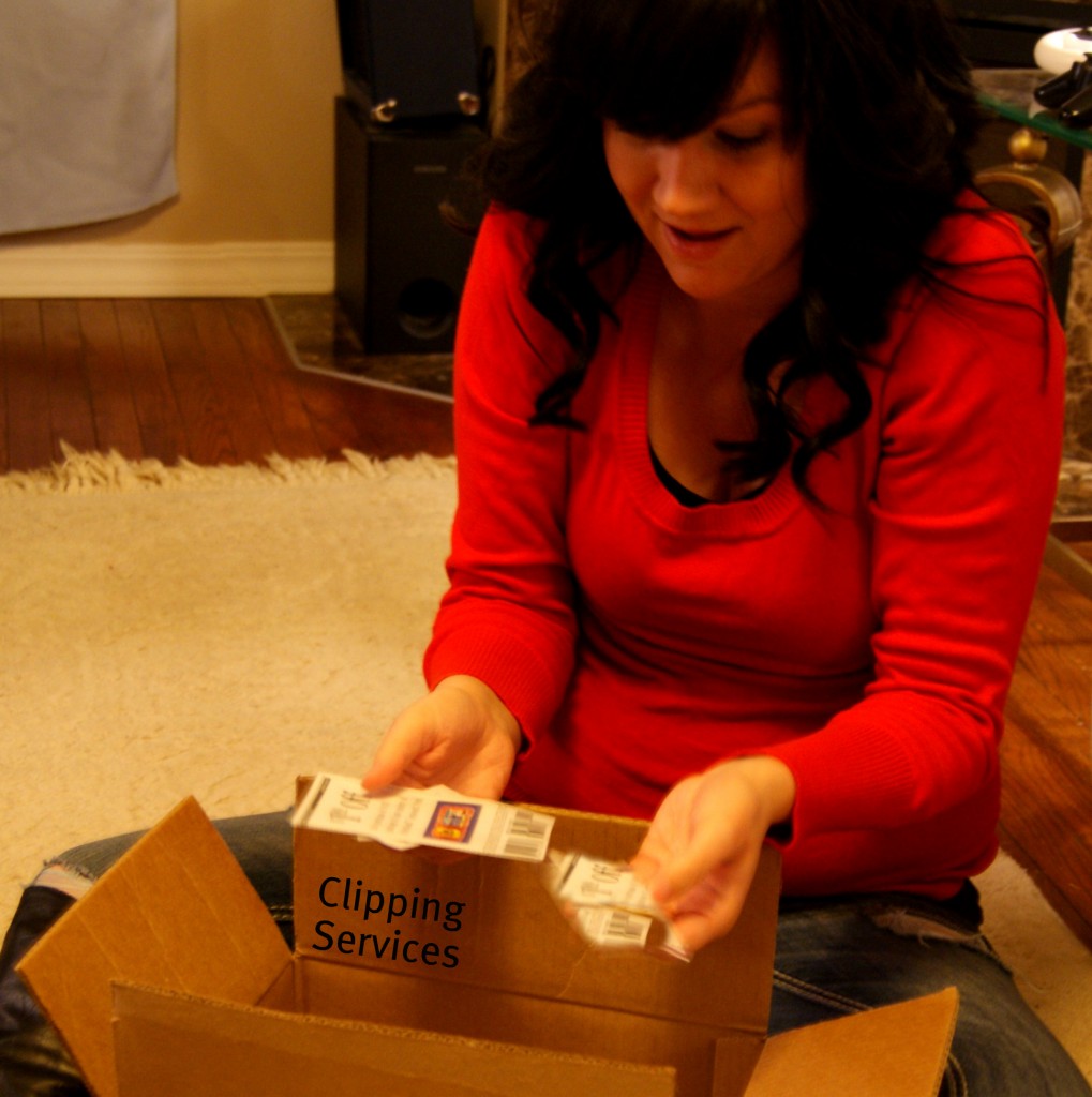 woman opening up box of coupons