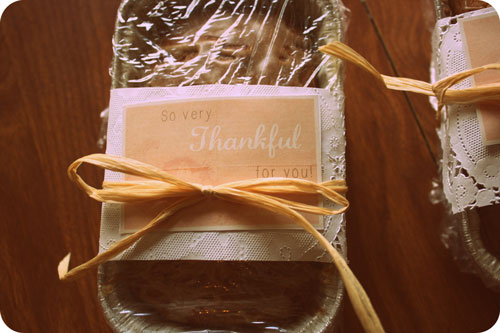 Loaf of cinnamon glazed pumpkin spice bread wrapped with a label that reads \"So very Thankful for you!\"