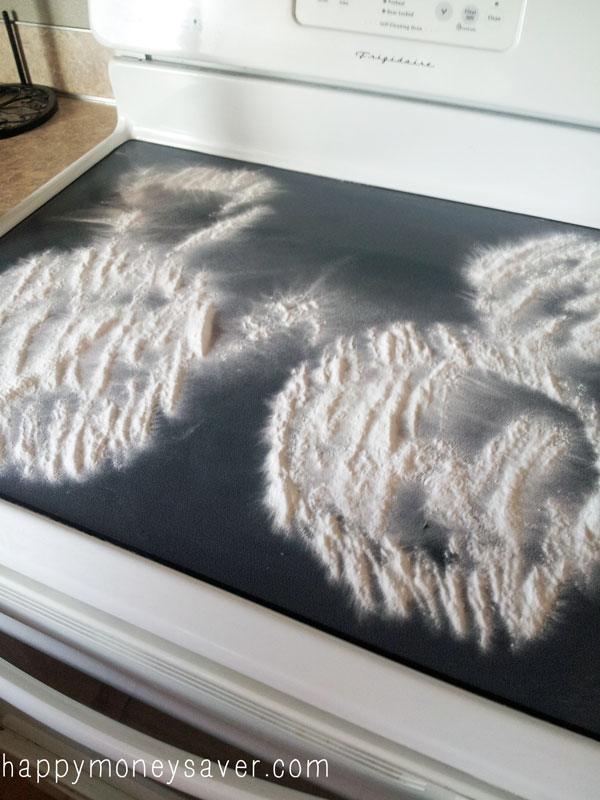 clean glass stove top with baking soda and vinegar