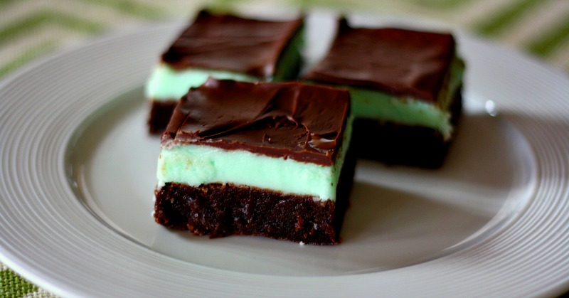 Creme De Menthe Brownies- A moist brownie, covered in a creme de menthe butter-cream frosting and topped with a thin layer of chocolate. #stpatricksday #irish #brownies #chocolate