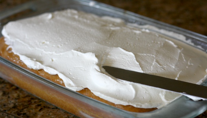 Coconut Cream Poke Cake - uses cream of coconut and sweetened condensed milk to make it so moist. My new favorite cake!!!