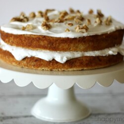 This vintage banana cake recipe is to die for. Cake is moist and has a sweet banana flavor. It is frosted with homemade whipped cream and chopped walnuts.