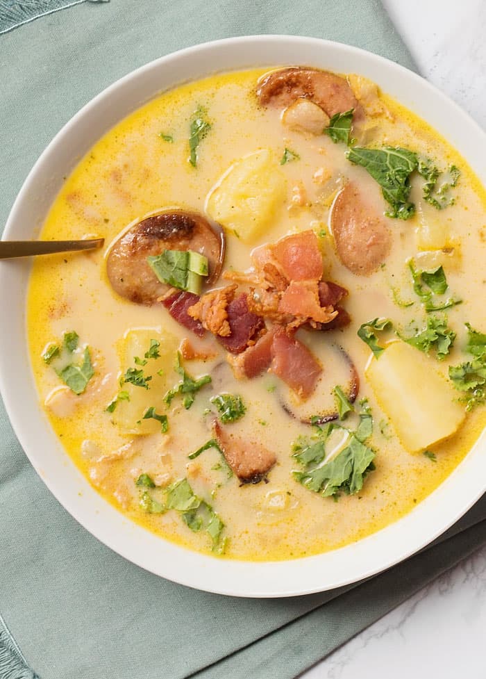 soup in a white bowl with a spoon out the side