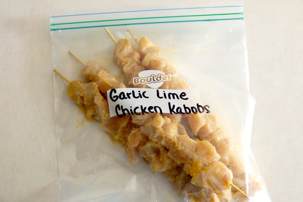 These freezer friendly garlic lime chicken kabobs will make you a dinner time hero! They are quick, easy and super delicious! | happymoneysaver.com