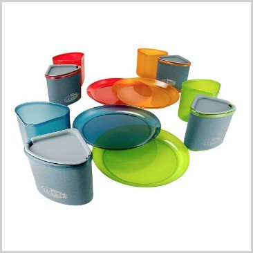 Plates and cups in colored plastic on a list of 18 cool camping equipment ideas.