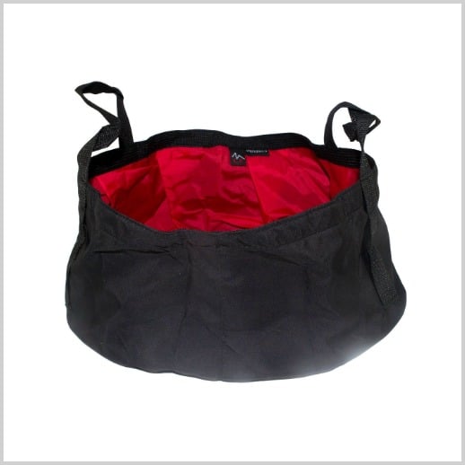 A portable folding washing basin in black with a red lining.