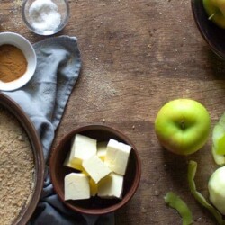Apple brown Betty ingredients on a wooden table.