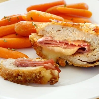 Chicken cordon bleu and carrots on a plate.