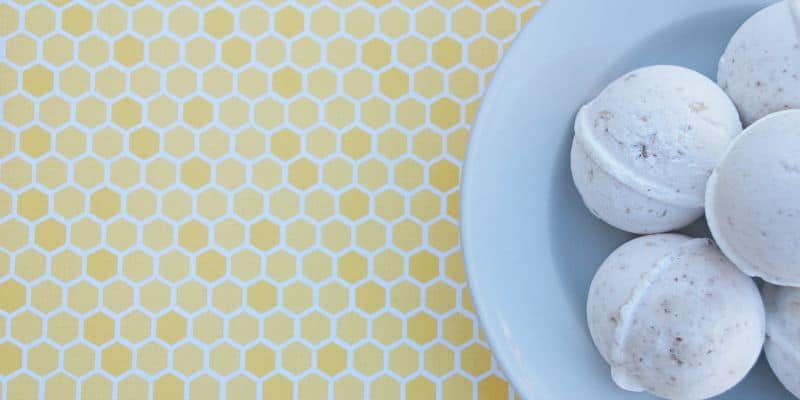 Plate of bath bombs on a white and yellow honeycomb pattern.