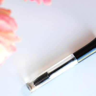 Eyelash brush with pink flowers.