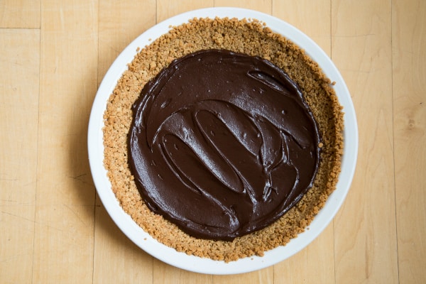 The smooth coconut custard and sweet chocolate ganache are sure to make all of your Chocolate Coconut Pie dreams come true! Straight forward and easy recipe. | happymoneysaver.com