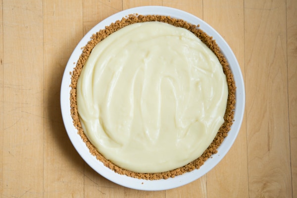 The smooth coconut custard and sweet chocolate ganache are sure to make all of your Chocolate Coconut Pie dreams come true! Straight forward and easy recipe. | happymoneysaver.com