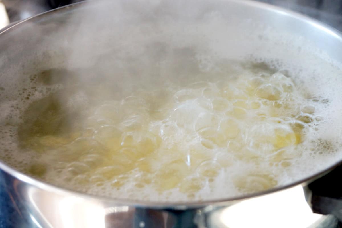 make ahead mashed potatoes boiling in pot