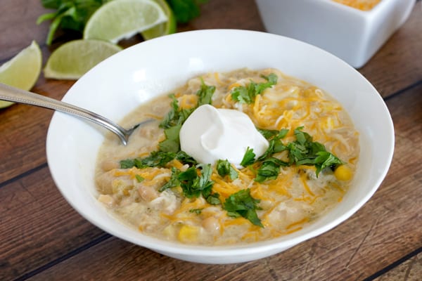 This creamy white chicken chili recipe is so delicious and full of flavor! Easily double or triple the batch and stock up your freezer! | happymoneysaver.com