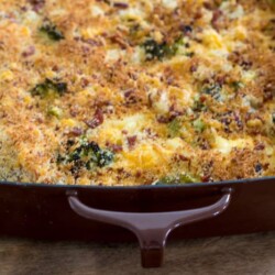 Cheesy broccoli potato bake in a baking dish.