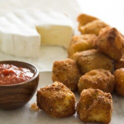 Fried Brie Bites - Crunchy, creamy and oh so cheesy. You can also make ahead and freeze them for last minute company or for a party. YUMMERS!!!