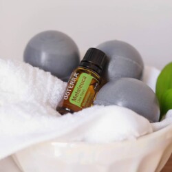 Activated charcoal soap balls in a bowl with Tea Tree doTerra essential oil.