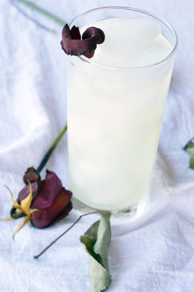 Tall glass of rose-infused lemonade.