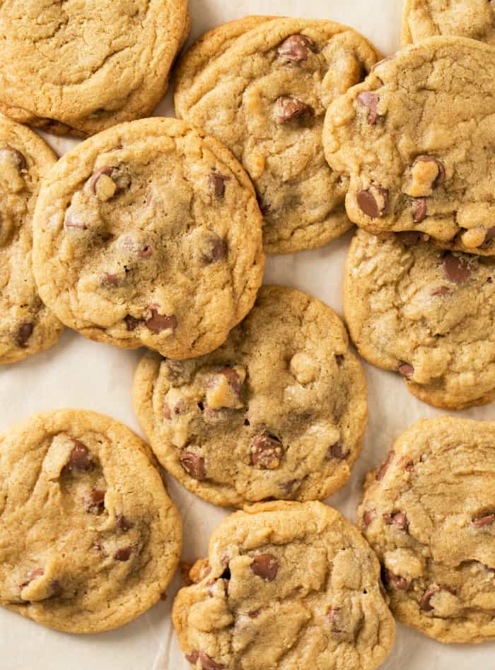 Chocolate chip cookies on parchment paper.