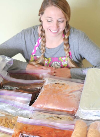 Karrie smiling looking at bags of food.