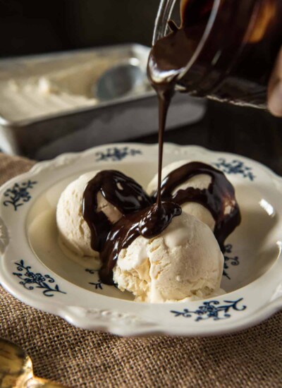 This No-Churn Homemade Vanilla Ice Cream recipe is SO easy - no extra appliances required! (Top it with Freezer Friendly Hot Fudge Sauce for a real treat!) | happymoneysaver.com