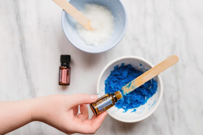 adding peppermint essential oils to diy sugar scrub recipe 