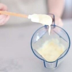 Spatula scooping homemade mayonnaise.