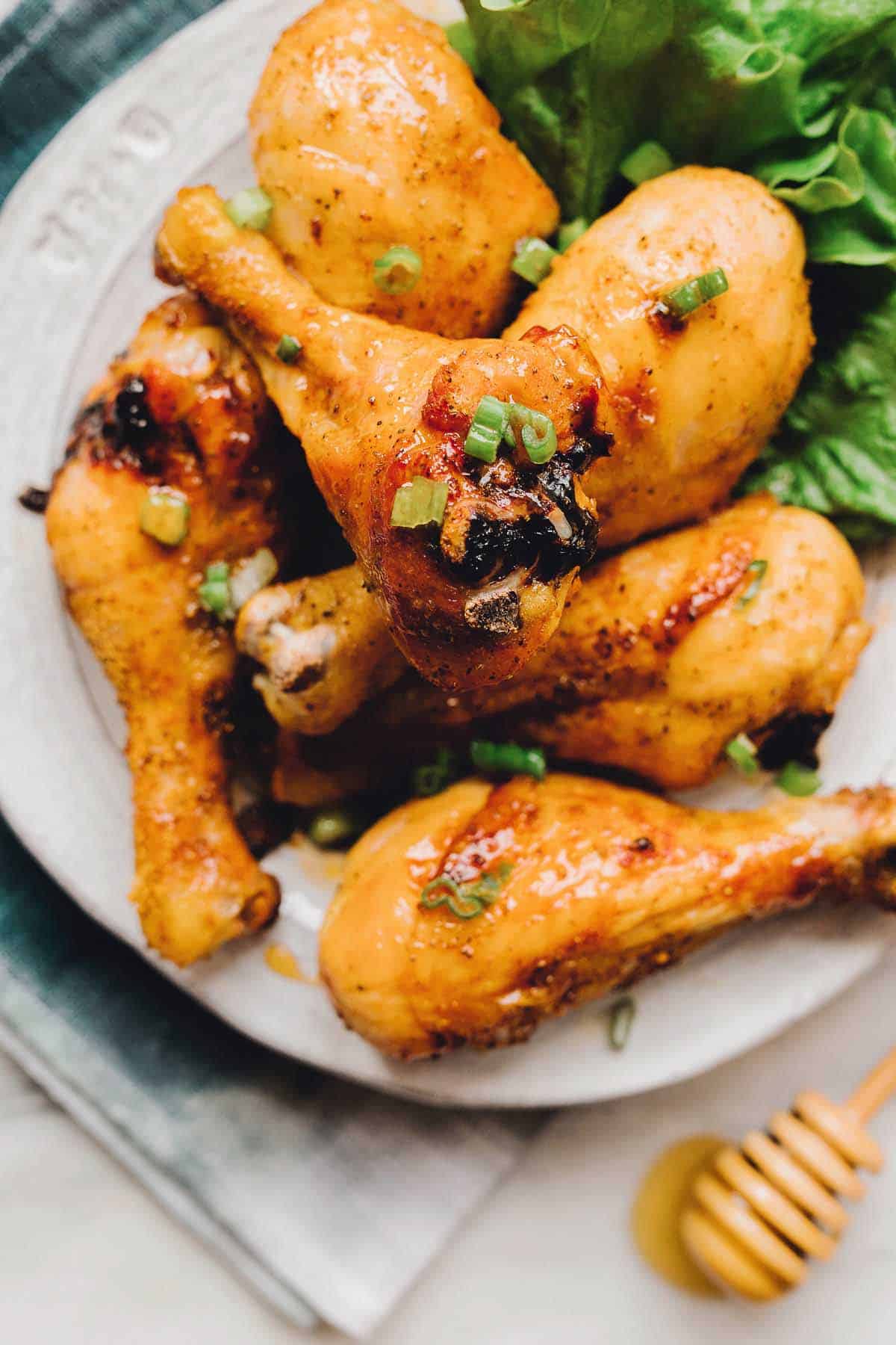 Get ready for your life to be changed after you take one bite of these Spicy Honey Chicken Drumsticks. They are THAT good.