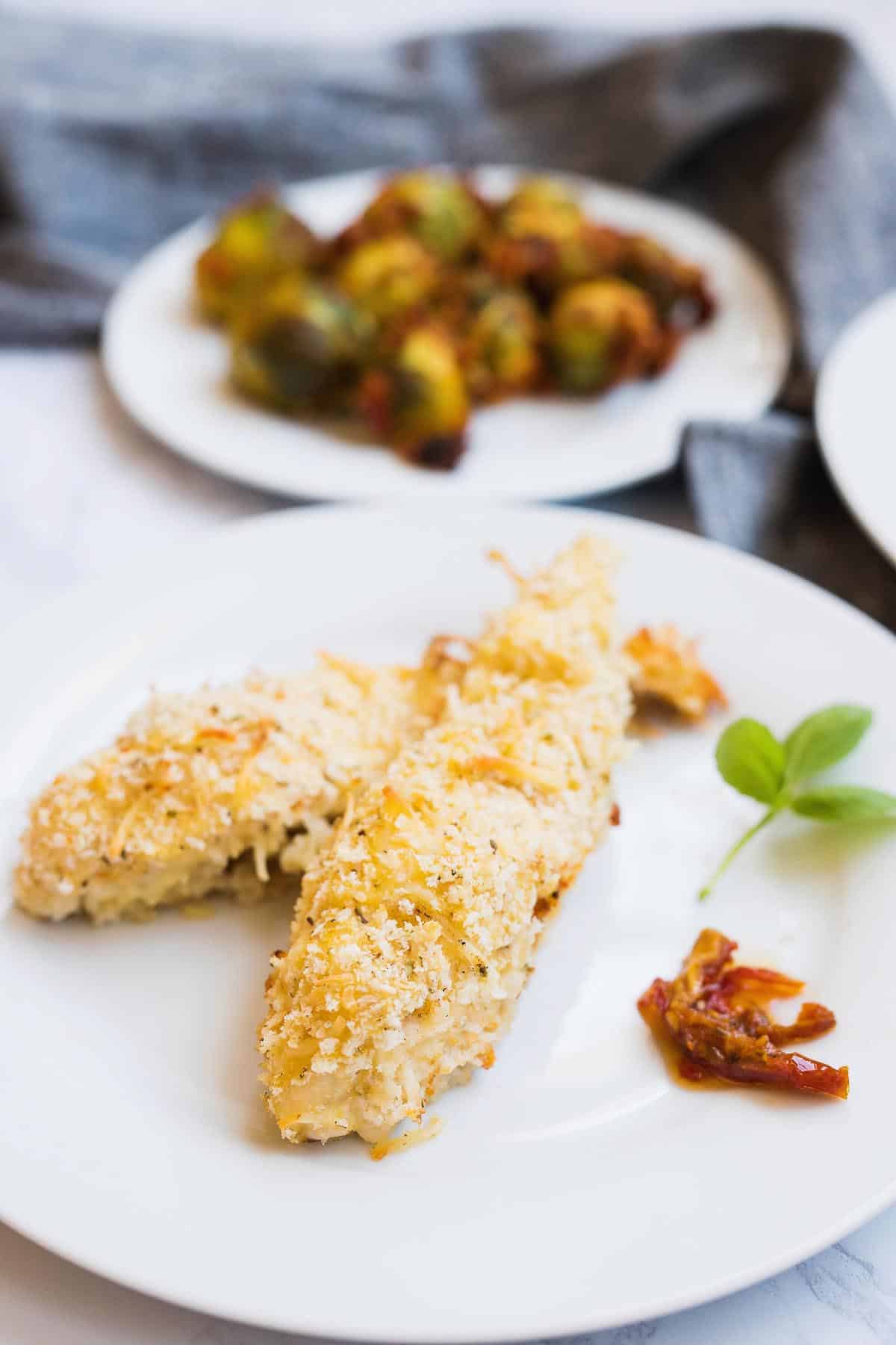 Need a quick dinner? Try this Cheesy Crunch Chicken & Italian Brussel Sprouts Bake! This dish comes together super simply and is cooked all in one dish. Can I get a hallelujah?! 