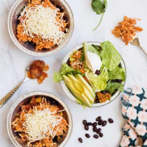 Nothing beats a good Chicken Burrito Bowl! It is packed with seasoned chicken, homemade Spanish Rice, beans, cheese, salsa, and all the fresh toppings your heart desires. Yum!