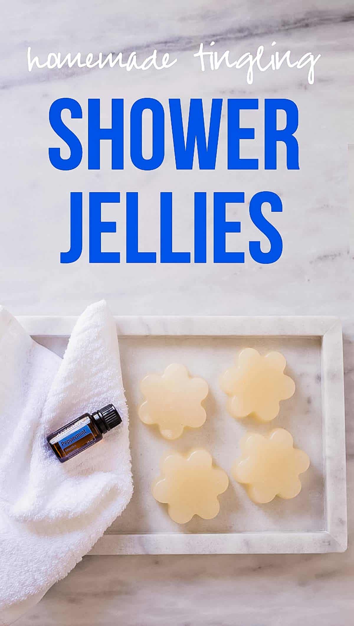 How to Make Shower Jellies at home. 4 bars of the softest, squishiest jelly soap on a marble platter with pepperment essential oil bottle. 