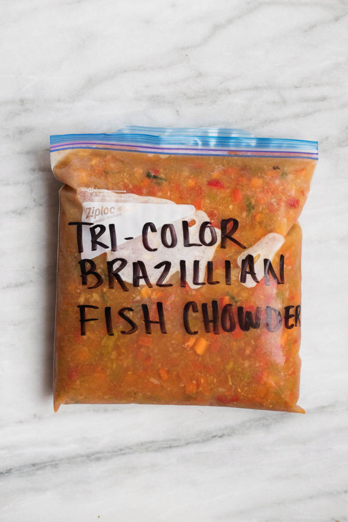 Tri color Brazilian fish chowder in a gallon sized freezer safe bag. Moqueca