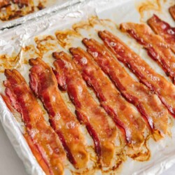 Cooked bacon on parchment paper.