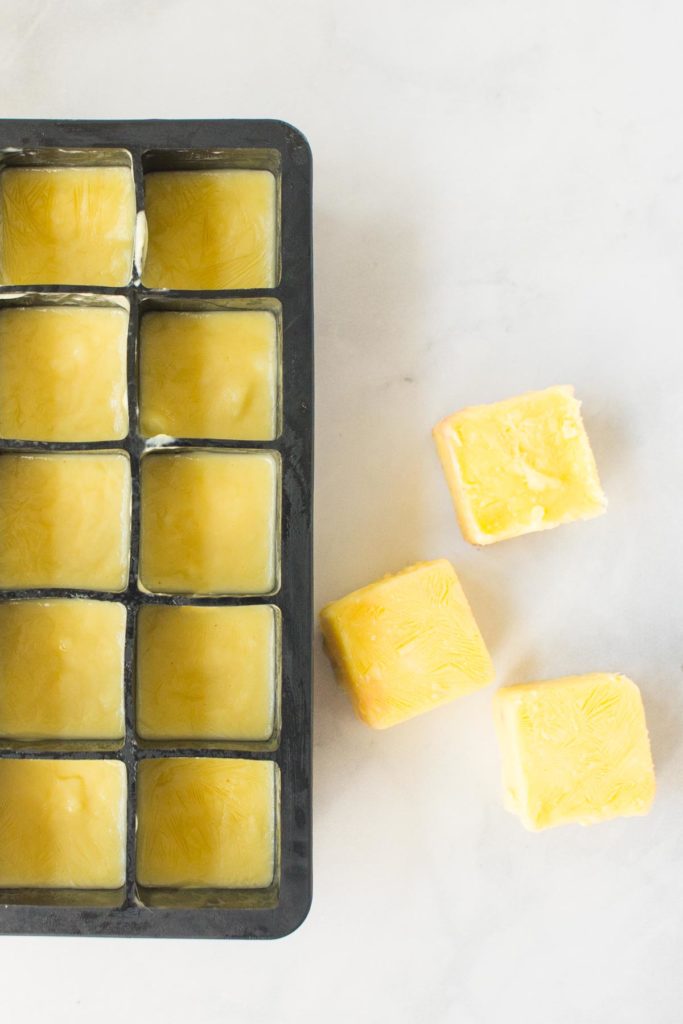 Frozen cubes of yellow smoothie base.