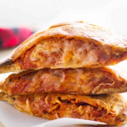 Stack of homemade pizza pockets.