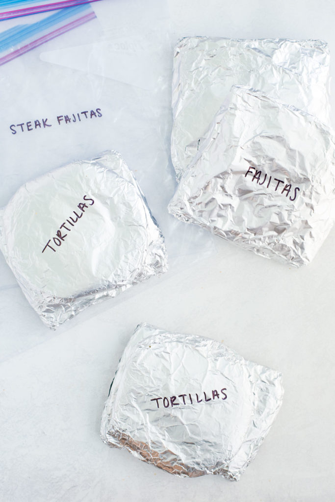 There are four foil packets with the words tortillas on two packets and fajitas on the other packet.  There is also a gallon size zipped bag with the word steak fajitas on it.