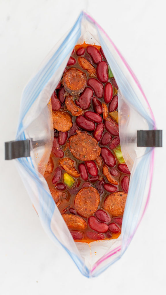 downward shot of Simple chili with smoked sausage and red kidney beans in a gallon sized freezer bag