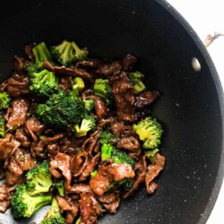 Beef and broccoli teriyaki in a wok.