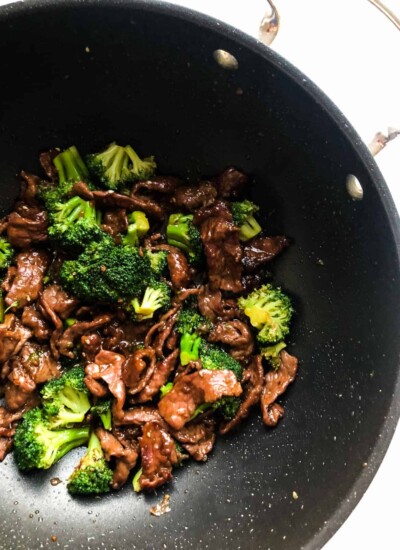 Beef and broccoli teriyaki in a wok.