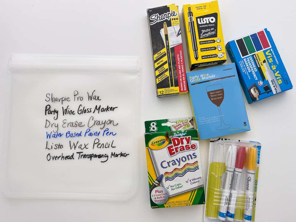 Packages of markers next to a reusable freezer bag with writing from each on it.