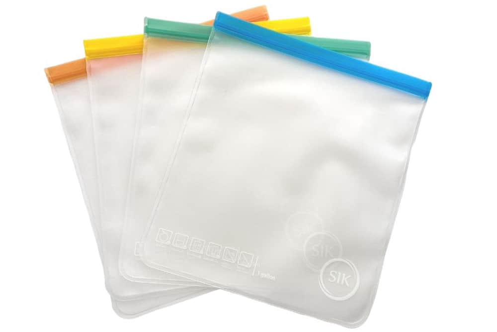 4 Empty SIK reusable freezer bags spread out on a white background