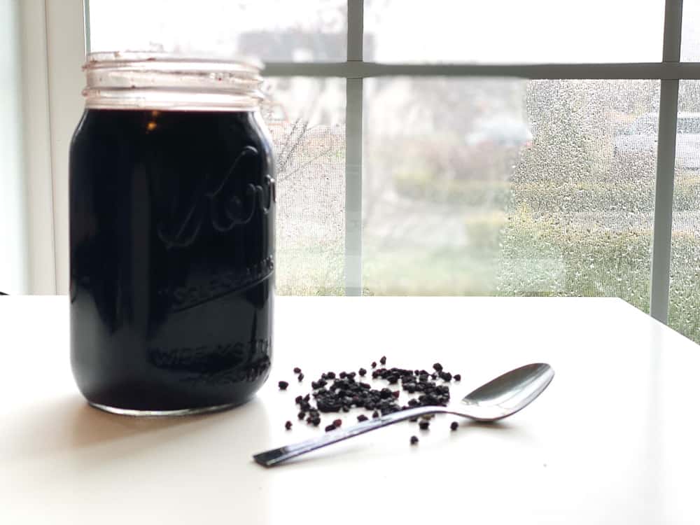 Elderberry syrup in a quart sized jar